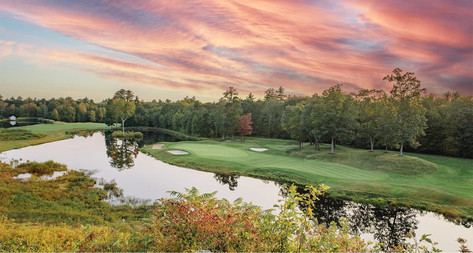 Ledges Golf course hole overview with pink sunset in distance